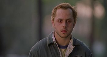 Movie still from “The Gift” (2000), directed by Sam Raimi – A person wearing a shirt and jacket; Close Up shot, Low angle