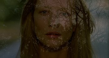 Movie still from “The Gift” (2000), directed by Sam Raimi – A woman with a tree in the background; Close Up shot, Overhead angle