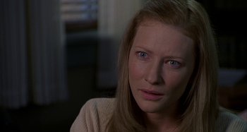 Movie still from “The Gift” (2000), directed by Sam Raimi – A person with long blonde hair; Close Up shot, Over the shoulder angle