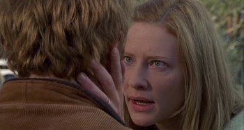 Movie still from “The Gift” (2000), directed by Sam Raimi – A person holding another person's face; Close Up shot, Over the shoulder angle
