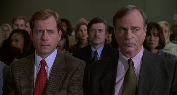 Movie still from “The Gift” (2000), directed by Sam Raimi – A group of men in suits and ties standing next to each other; Close Up shot, High angle