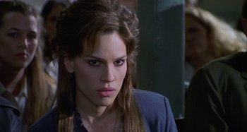 Movie still from “The Gift” (2000), directed by Sam Raimi – A person with long brown hair; Close Up shot, Over the shoulder angle