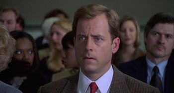 Movie still from “The Gift” (2000), directed by Sam Raimi – A person wearing a suit and a tie; Close Up shot, Over the shoulder angle
