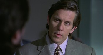Movie still from “The Gift” (2000), directed by Sam Raimi – A man in a suit and tie looking at the camera; Close Up shot, Over the shoulder angle