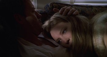 Movie still from “The Gift” (2000), directed by Sam Raimi – A man and a woman laying on a bed; Close Up shot, Low angle
