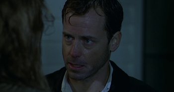 Movie still from “The Gift” (2000), directed by Sam Raimi – A person wearing a jacket; Close Up shot, Over the shoulder angle