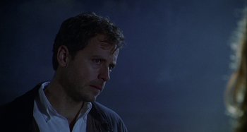 Movie still from “The Gift” (2000), directed by Sam Raimi – A person wearing a jacket; Close Up shot, Over the shoulder angle
