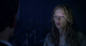 Movie still from “The Gift” (2000), directed by Sam Raimi – A woman with long brown hair stares into the distance; Close Up shot, Low angle