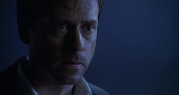 Movie still from “The Gift” (2000), directed by Sam Raimi – A man's face in the dark; Close Up shot, Over the shoulder angle