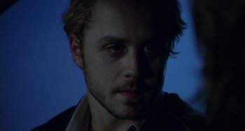 Movie still from “The Gift” (2000), directed by Sam Raimi – A person wearing a jacket; Close Up shot, Low angle