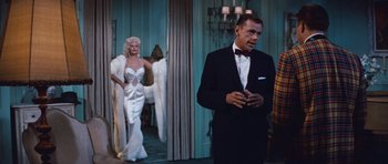 Movie still from “The Girl Can't Help It” (1956), directed by Frank Tashlin – A man and a woman dressed in formal wear; Wide shot, Low angle