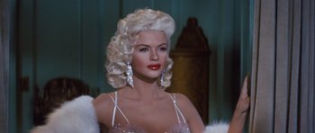 Movie still from “The Girl Can't Help It” (1956), directed by Frank Tashlin – A woman with white hair and red lipstick; Close Up shot, Low angle