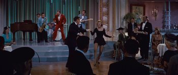 Movie still from “The Girl Can't Help It” (1956), directed by Frank Tashlin – A man and a woman dancing on a dance floor; Wide shot, High angle