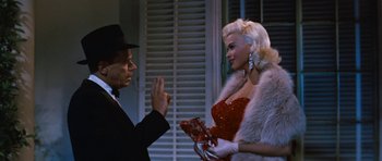 Movie still from “The Girl Can't Help It” (1956), directed by Frank Tashlin – A man and a woman are talking to each other; Medium shot, Over the shoulder angle