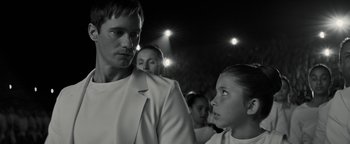 Movie still from “The Giver” (2014), directed by Phillip Noyce – A black and white photo of a man and two girls; Close Up shot, Over the shoulder angle