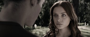 Movie still from “The Giver” (2014), directed by Phillip Noyce – A young woman and a young man staring at one another; Close Up shot, Over the shoulder angle