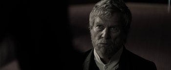 Movie still from “The Giver” (2014), directed by Phillip Noyce – An old man with a beard and a white shirt; Close Up shot, Over the shoulder angle