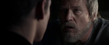 Movie still from “The Giver” (2014), directed by Phillip Noyce – An older man looking into a mirror while a younger man stares at him; Close Up shot, Over the shoulder angle