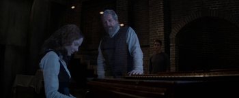 Movie still from “The Giver” (2014), directed by Phillip Noyce – A man and a woman standing next to each other; Wide shot, Over the shoulder angle