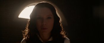 Movie still from “The Giver” (2014), directed by Phillip Noyce – A person in a dark room; Close Up shot, Low angle