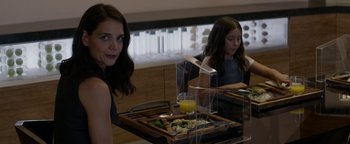 Movie still from “The Giver” (2014), directed by Phillip Noyce – A woman sitting at a table in front of a plate of food; Close Up shot, Over the shoulder angle