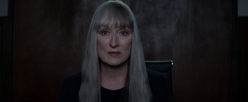 Movie still from “The Giver” (2014), directed by Phillip Noyce – A woman with long gray hair and a black shirt; Close Up shot, Over the shoulder angle