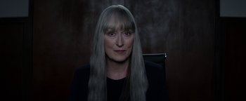 Movie still from “The Giver” (2014), directed by Phillip Noyce – A woman with long gray hair sitting in a chair; Close Up shot, Over the shoulder angle