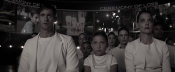 Movie still from “The Giver” (2014), directed by Phillip Noyce – A black and white photo of a group of people; Medium shot, Over the shoulder angle