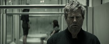 Movie still from “The Giver” (2014), directed by Phillip Noyce – A man and a woman are standing next to each other; Close Up shot, Over the shoulder angle