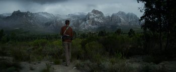 Movie still from “The Giver” (2014), directed by Phillip Noyce – A man walking on a path in the middle of a field; Wide shot, Low angle