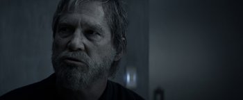 Movie still from “The Giver” (2014), directed by Phillip Noyce – An older man with a beard looking into the distance; Close Up shot, Over the shoulder angle