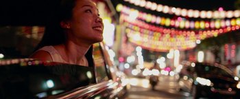 Movie still from “The Giver” (2014), directed by Phillip Noyce – A woman is smiling at the camera in the night; Close Up shot, Low angle