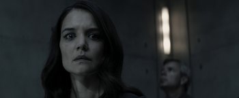 Movie still from “The Giver” (2014), directed by Phillip Noyce – A woman with long black hair looking at the camera; Close Up shot, Over the shoulder angle