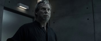 Movie still from “The Giver” (2014), directed by Phillip Noyce – An older man with a beard is looking at the camera; Close Up shot, Over the shoulder angle