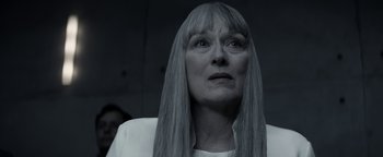 Movie still from “The Giver” (2014), directed by Phillip Noyce – An older woman with long gray hair stares into the distance; Close Up shot, Low angle