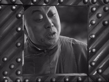Movie still from “The Good Earth” (1937), directed by Sidney Franklin – An old man is looking at himself in the mirror; Close Up shot, Low angle
