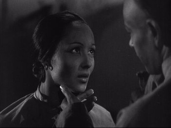 Movie still from “The Good Earth” (1937), directed by Sidney Franklin – A black and white photo of a woman and a man; Close Up shot, Over the shoulder angle
