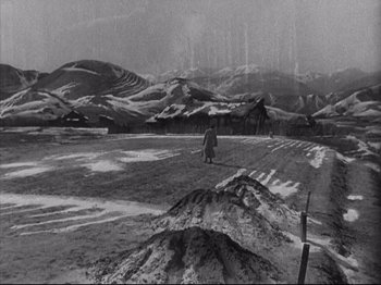 Movie still from “The Good Earth” (1937), directed by Sidney Franklin – A man standing in the middle of an empty field; Extreme Wide shot, High angle