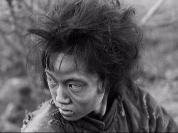 Movie still from “The Good Earth” (1937), directed by Sidney Franklin – An old photo of an asian woman with very long hair; Close Up shot, High angle