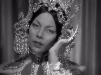 Movie still from “The Good Earth” (1937), directed by Sidney Franklin – A black and white photo of a woman in a costume; Close Up shot, Low angle
