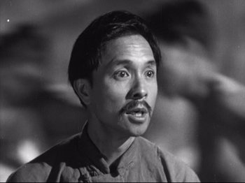 Movie still from “The Good Earth” (1937), directed by Sidney Franklin – Black and white photograph of a man with a mustache; Close Up shot, Low angle