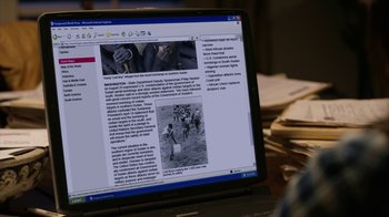 Movie still from “The Good Lie” (2014), directed by Philippe Falardeau – An open laptop computer sitting on top of a desk; Extreme Close Up shot, High angle