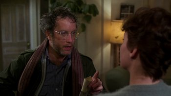 Movie still from “The Goodbye Girl” (1977), directed by Herbert Ross – A man wearing glasses talking to another man; Close Up shot, Over the shoulder angle