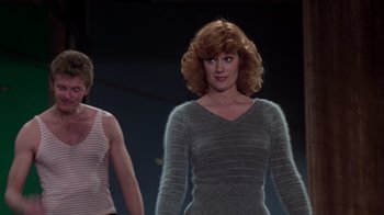 Movie still from “The Goodbye Girl” (1977), directed by Herbert Ross – A woman in a gray sweater and a man in a red shirt; Medium shot, Low angle