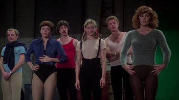 Movie still from “The Goodbye Girl” (1977), directed by Herbert Ross – A group of people standing next to each other; Medium shot, Low angle