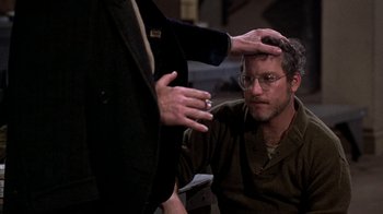 Movie still from “The Goodbye Girl” (1977), directed by Herbert Ross – A man with glasses is talking to another man in a suit; Close Up shot, Over the shoulder angle