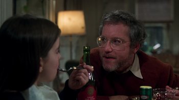 Movie still from “The Goodbye Girl” (1977), directed by Herbert Ross – An older man and a young girl are having a drink; Close Up shot, Over the shoulder angle