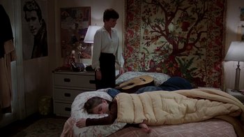 Movie still from “The Goodbye Girl” (1977), directed by Herbert Ross – A woman standing next to a child laying in a bed; Wide shot, High angle