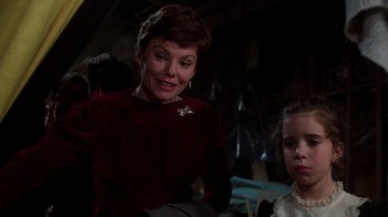 Movie still from “The Goodbye Girl” (1977), directed by Herbert Ross – An older woman and a young girl in a dark room; Close Up shot, Over the shoulder angle