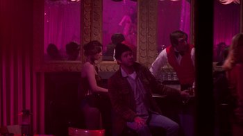 Movie still from “The Goodbye Girl” (1977), directed by Herbert Ross – A group of people sitting in a room; Wide shot, Over the shoulder angle